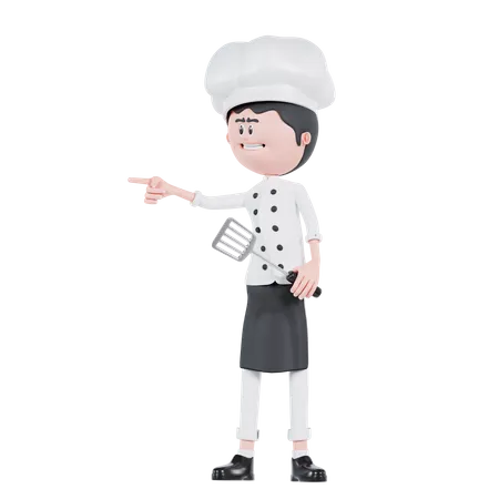 3 D Cartoon Chef Pointing To Right With Spatula 3D Illustration