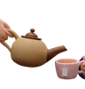 Hands Holding A Teapot And Mug
