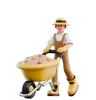 Male farmer pushing wheelbarrow